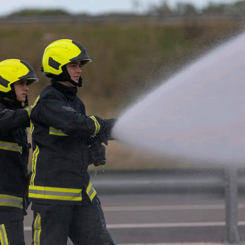 Delegates With Hose On Motorway