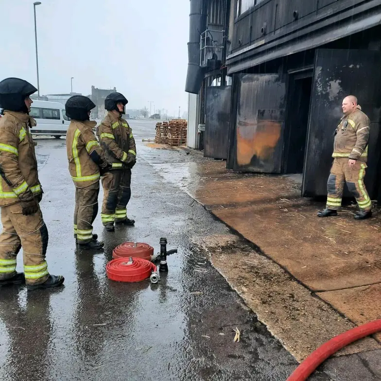 Trainees Outside Live Fire Training Building